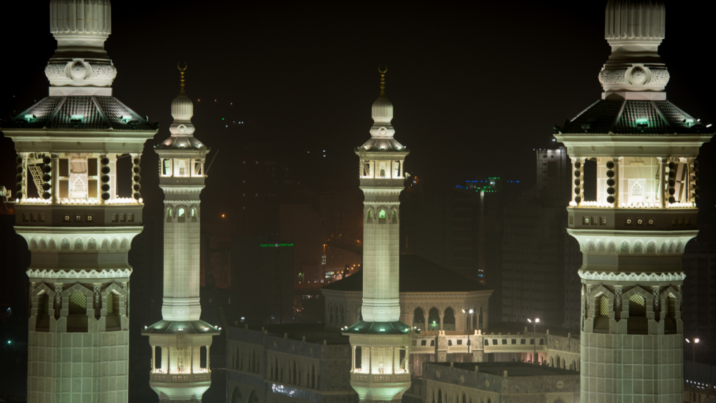 night time with minarets of mosques displayed