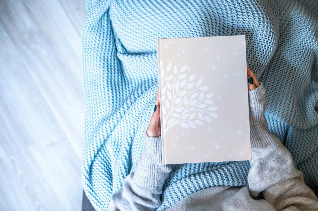 Woman holding the self-care planner