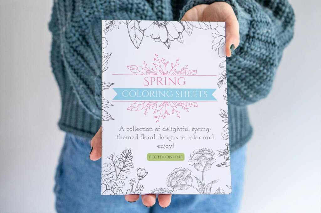 Spring Coloring Sheets book held by a woman